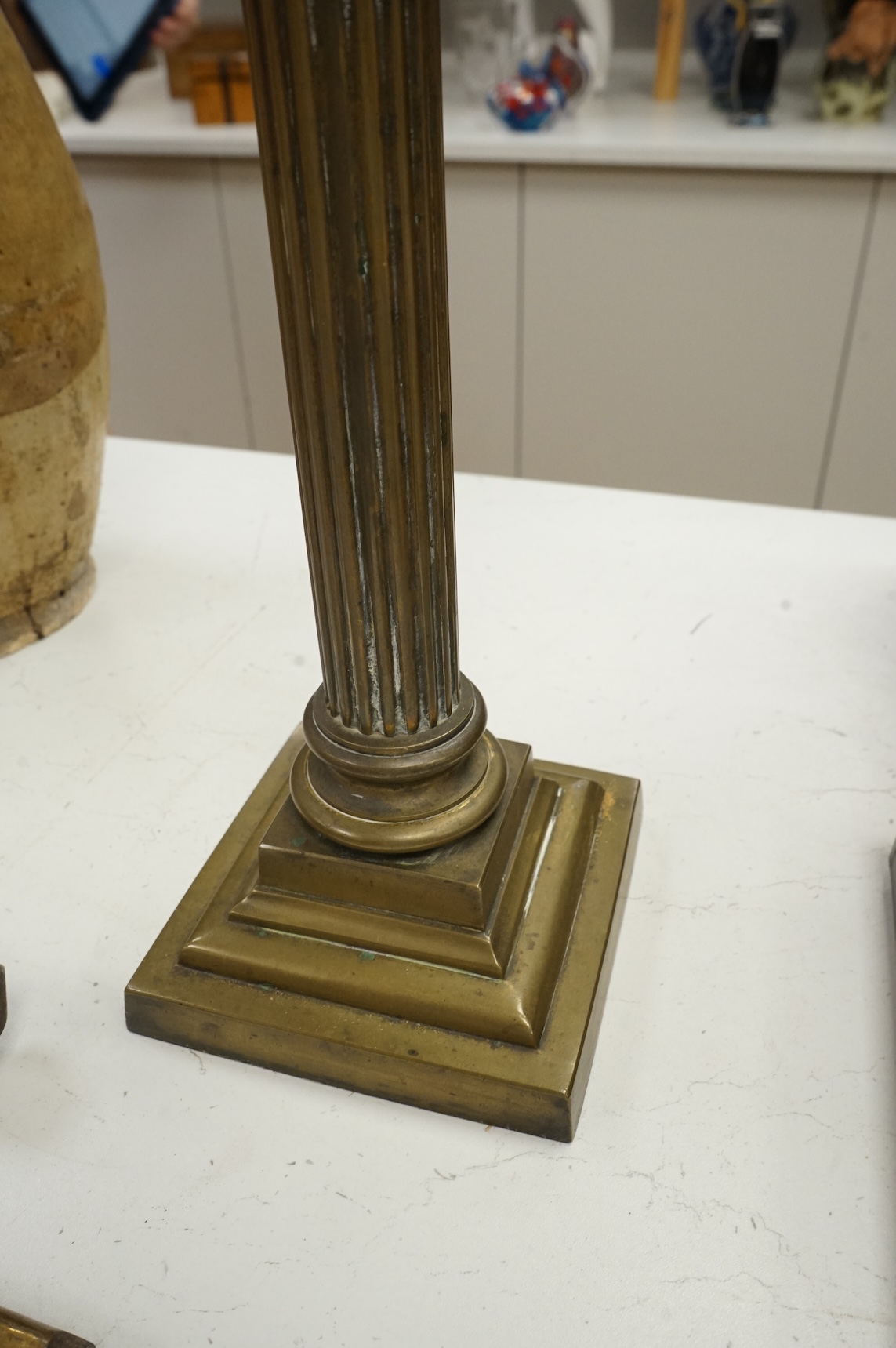 A brass oil lamp with columnar base and etched glass shade, 72cm high overall